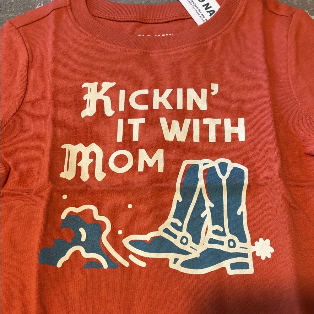 Old Navy Rust Colored Tee Featuring Boots, Spurs, Dust and Statement